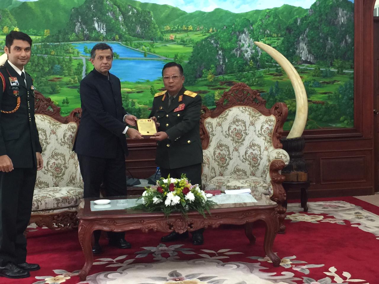 H.E. Mr. Dinkar Asthana, Ambassador of India presents a memento and a journal to H.E. Mr. Chansamone Chanyalath, Hon. Minister of National Defence of Lao PDR, to commemmorate the silver jubilee (25 years) of the Indian Army Training Team in Lao PDR.